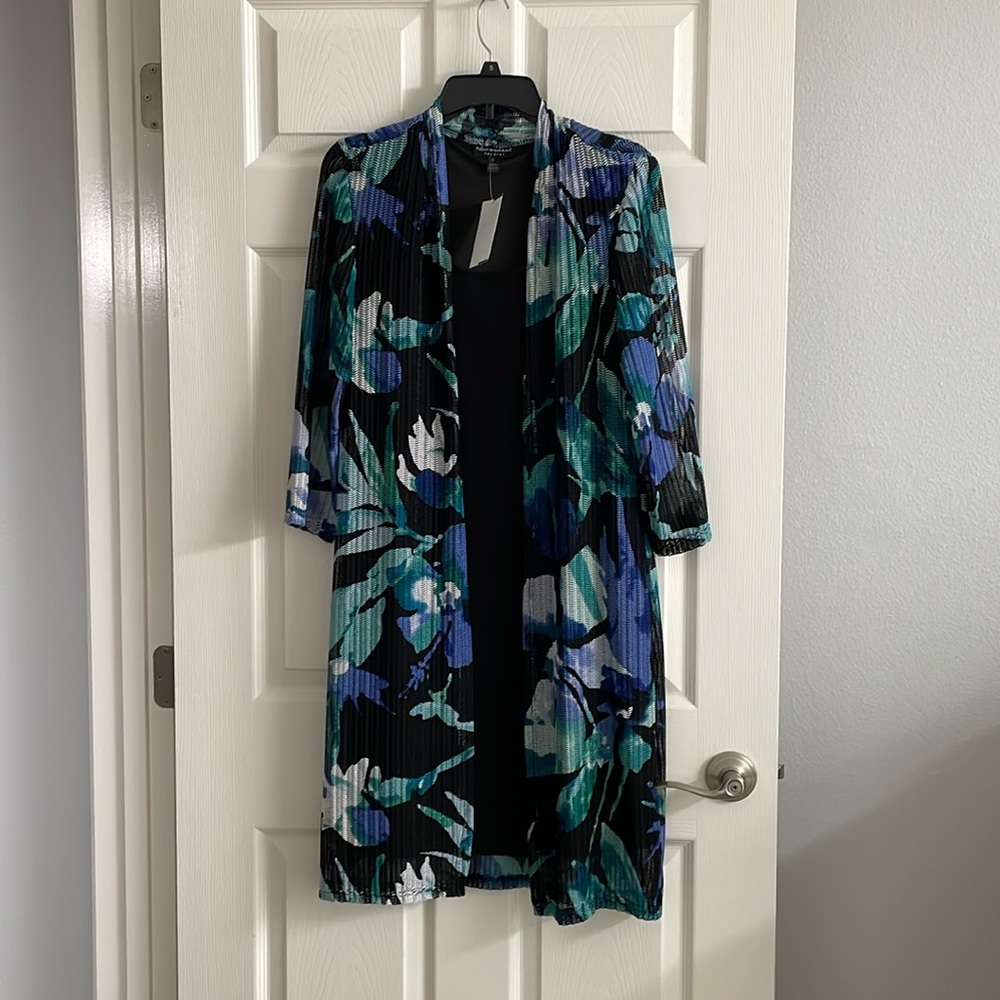 Black Sleeveless Dress with Floral Design Overlay.